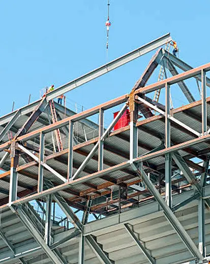Steel structure being erected with a crane on site